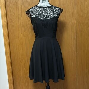 LBD: Black Guess mini dress with lace, side zipper, 100% polyester.
